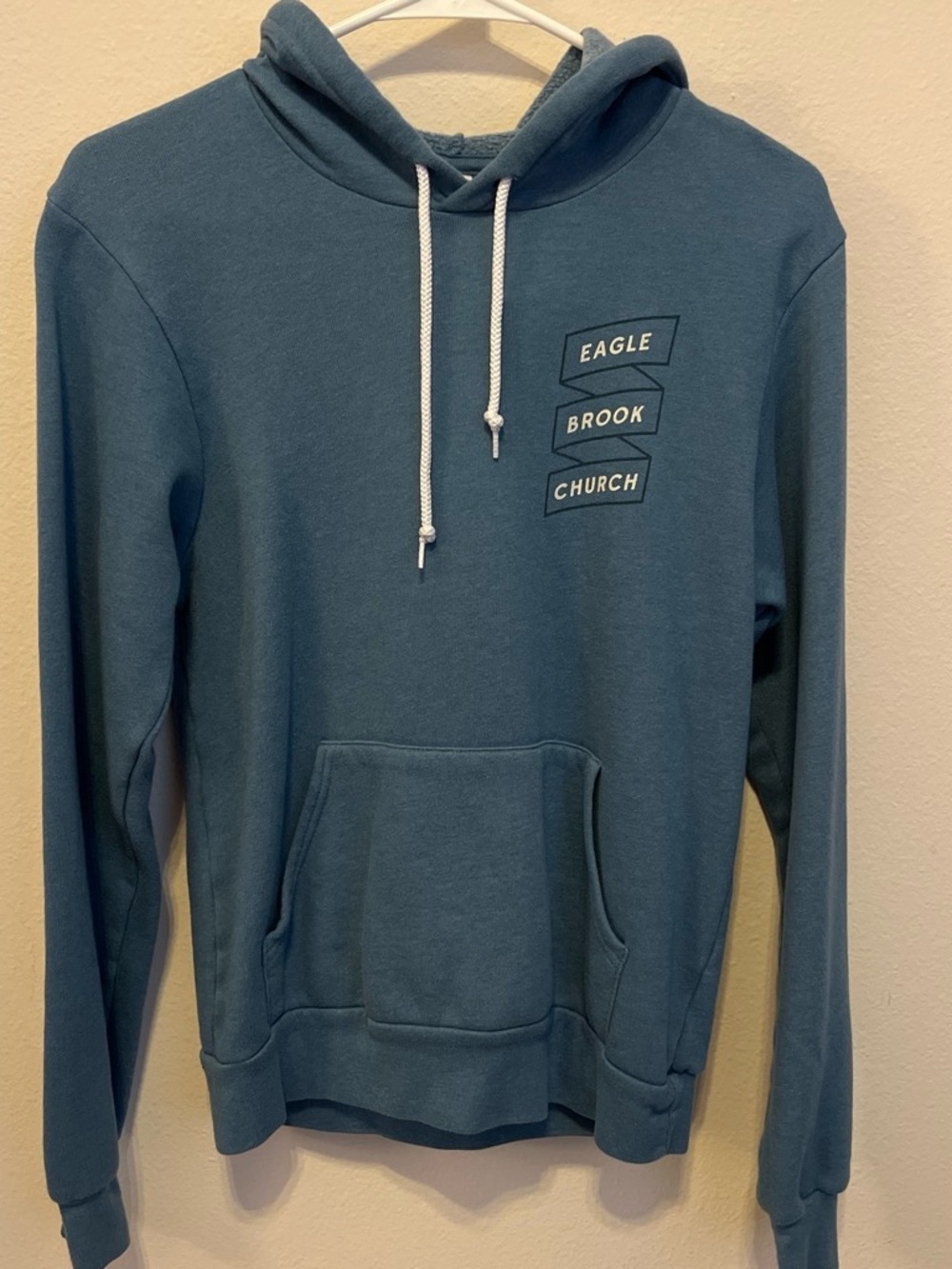Bella Canvas Teal Pullover Hoodie with Eagle Brook Church Logo